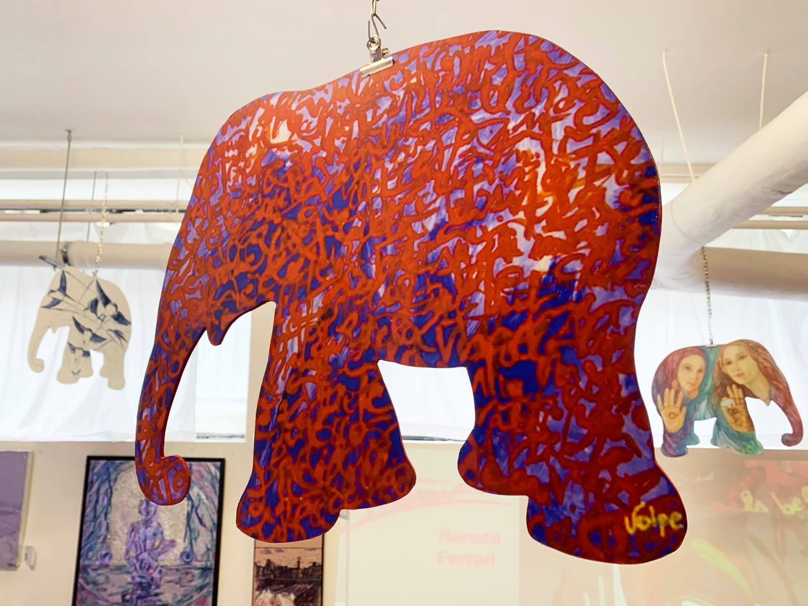 Colorful decorative elephant hanging in an art exhibition
